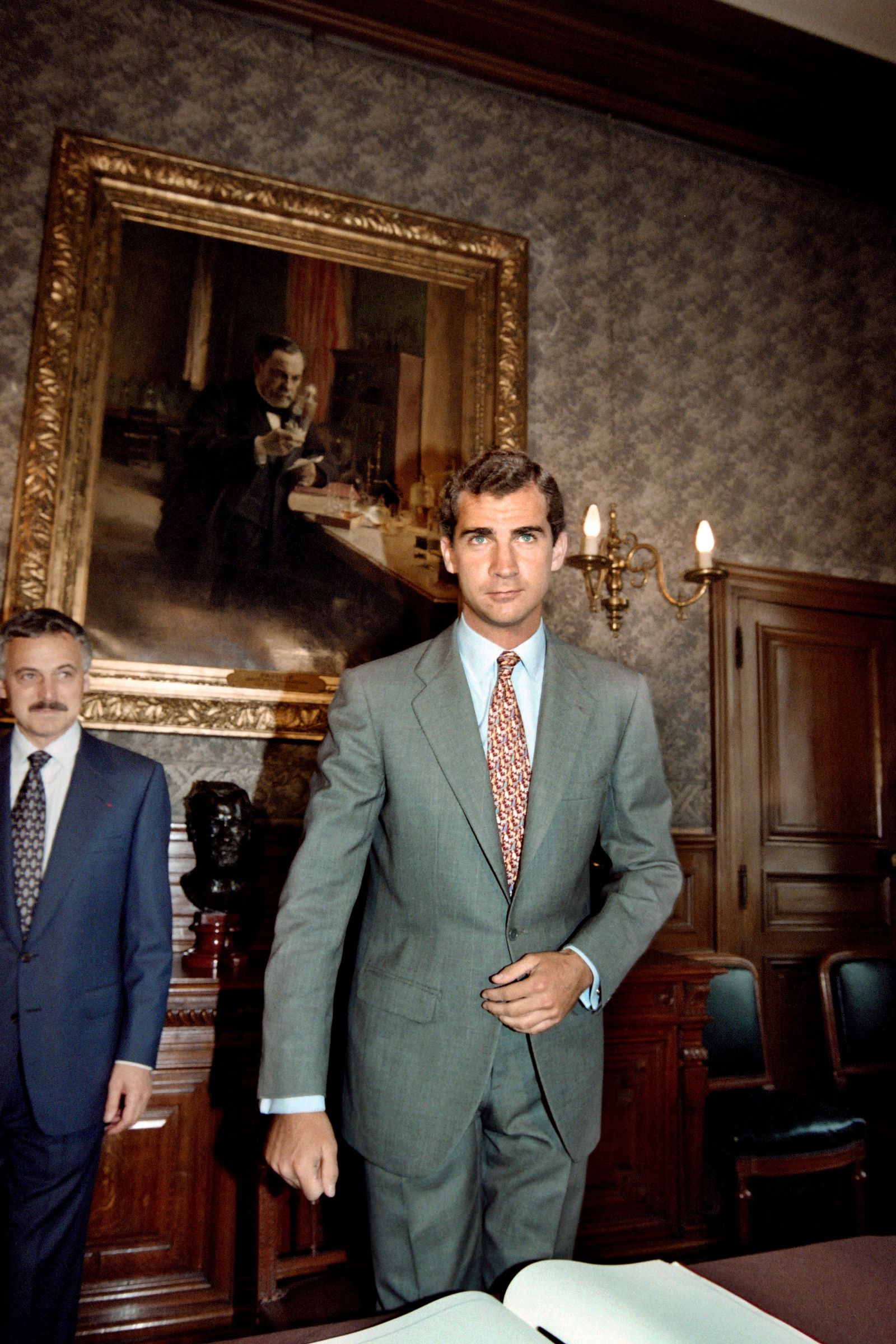 Image may contain Felipe VI of Spain Louis Pasteur Clothing Coat Blazer Jacket Formal Wear Suit Face and Head