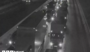 The lights of lorries show up in the dark with traffic at a standstill on the M6 southbound