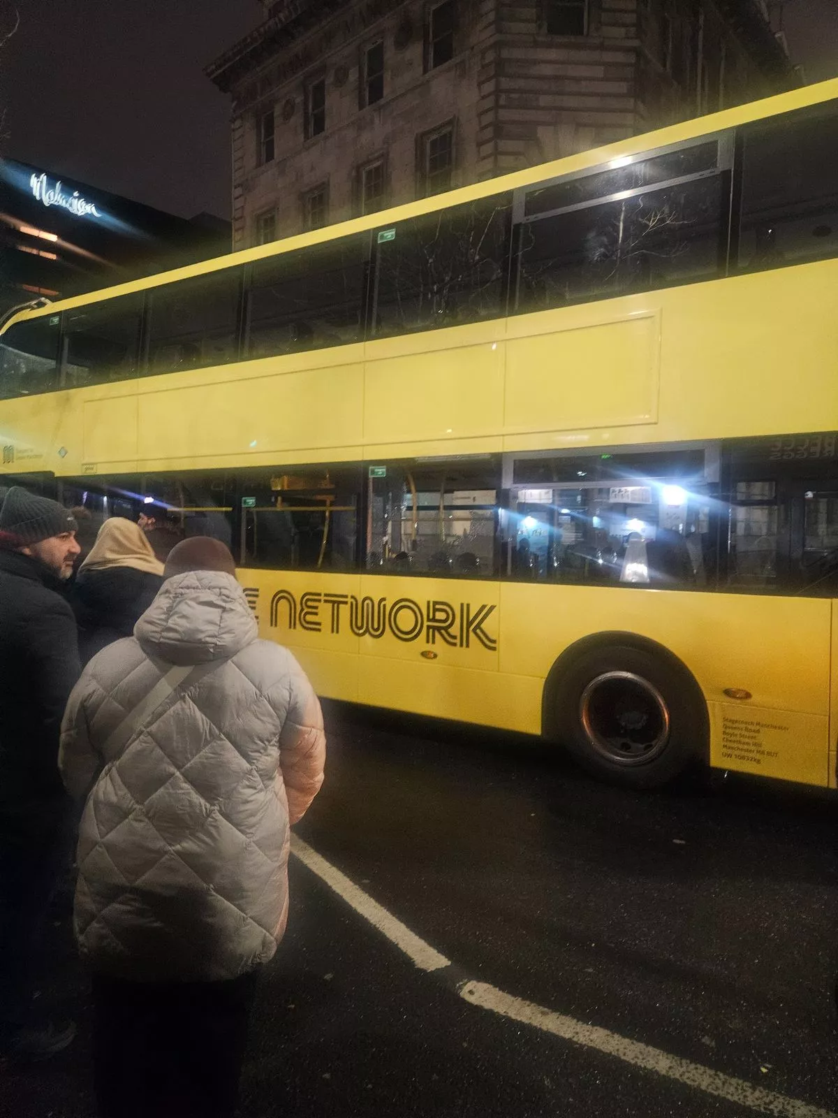 Damage to the side window of a Bee Network bus in Manchester city centre in the early hours of New Year's Day after a reported collision with another bus.