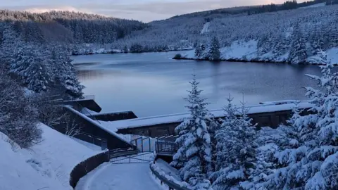 NI Water Altnaheglish Reservoir frozen with snow around it