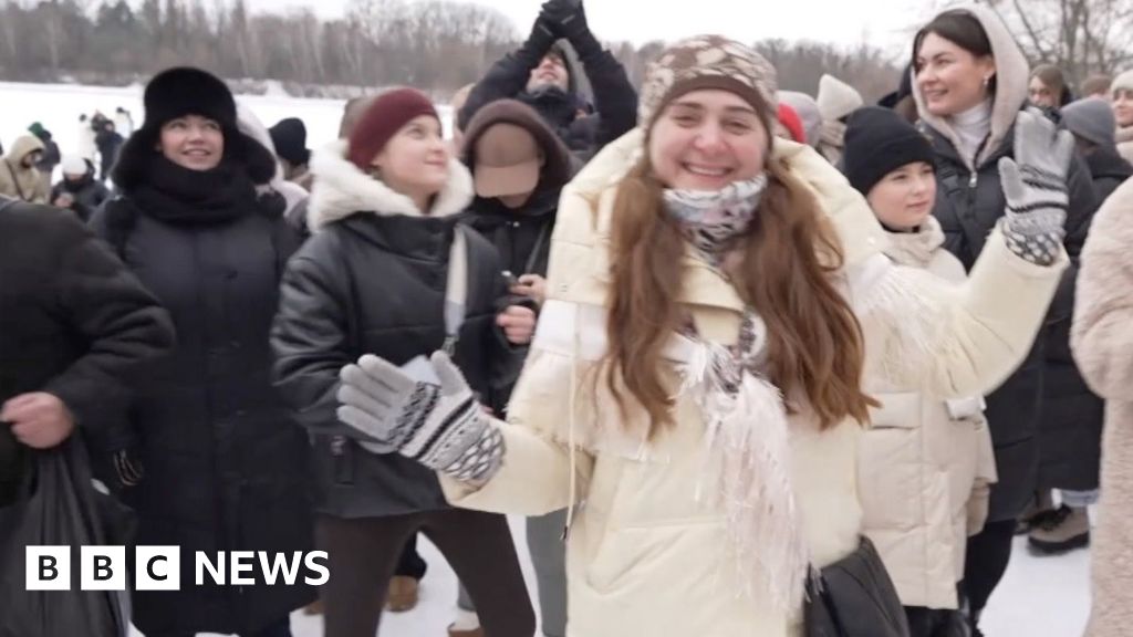 Frozen river hosts dance party in Kyiv