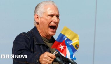 Cuban President Miguel Díaz-Canel holds Cuban and Venezuelan flags as he speaks at a rally in Havana in support of Venezuela. Photo: 3 January 2026