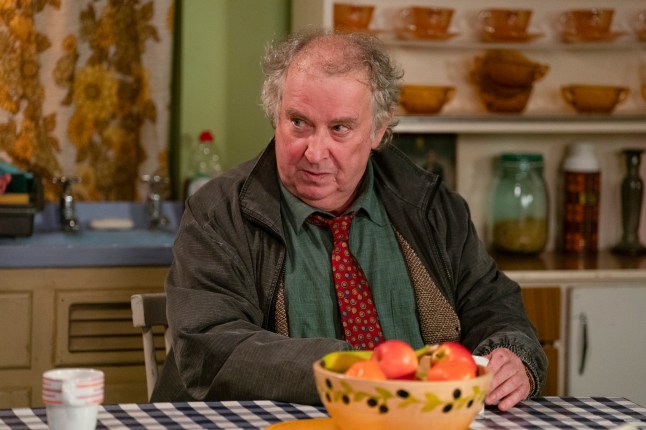 Nigel Bates sitting at the kitchen table in EastEnders
