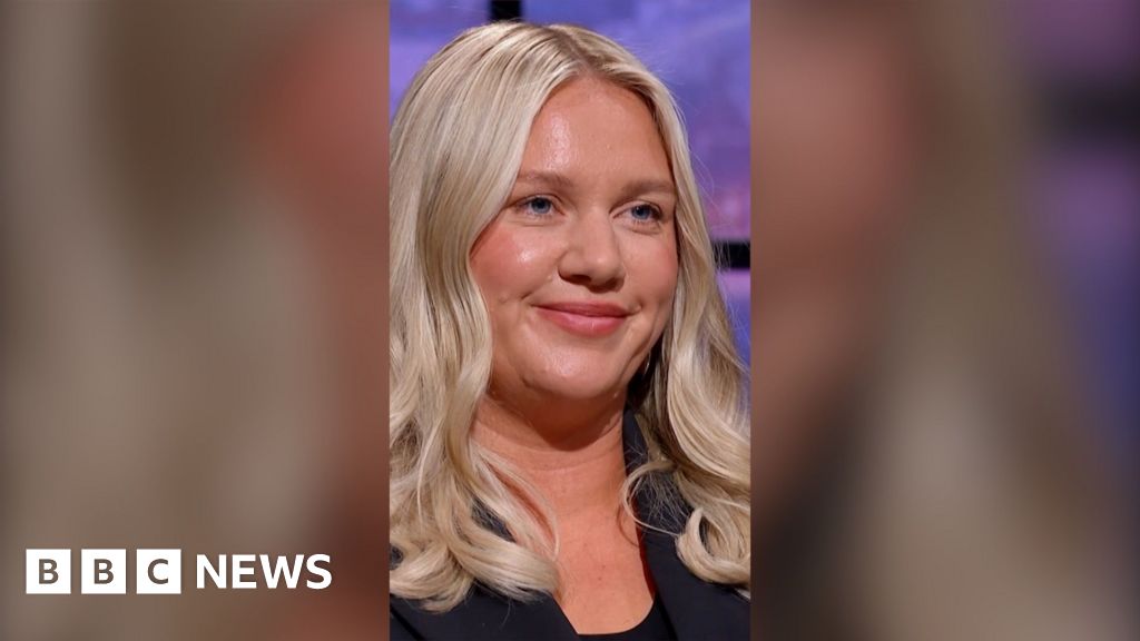 Businesswoman Jenna Meek appearing on Dragons' Den. She has long wavy blonde hair and is wearing a black jacket and top.