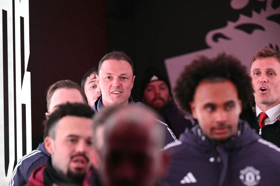 Jonny Evans (left) was also assistant to interim boss Darren Fletcher