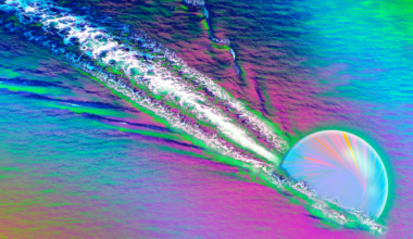 An illustration shows a quark racing through thye primordial soup or quark-gluon plasma that filled the early universe, creating a wave