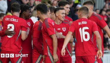 Luke Littler celebrates winning the 2026 PDC World Championship as tickertape falls