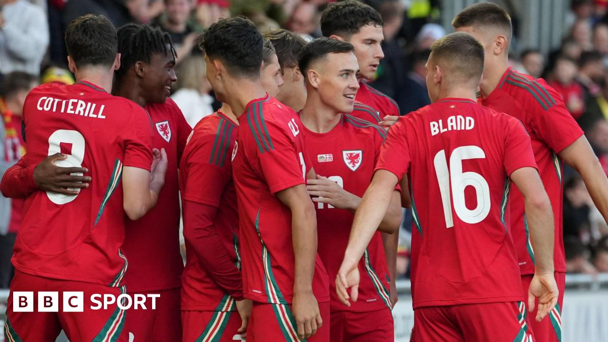 Luke Littler celebrates winning the 2026 PDC World Championship as tickertape falls