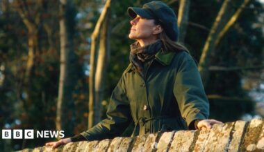Princess of Wales on a bridge in a coat on a walk in the countryside