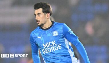 Ryan De Havilland looks for the ball while playing a match for Peterborough United.