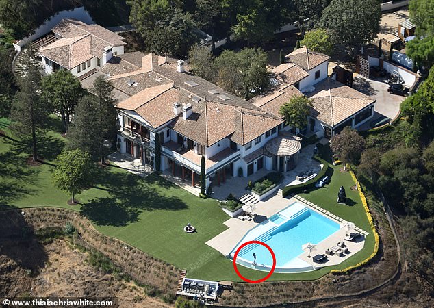 Before: The singer purchased Sylvester Stallone's eight-bed, 12-bath mansion in the exclusive Beverly Park neighborhood of Los Angeles for $58million where the actor had a statue of his iconic Rocky character in the swimming pool area