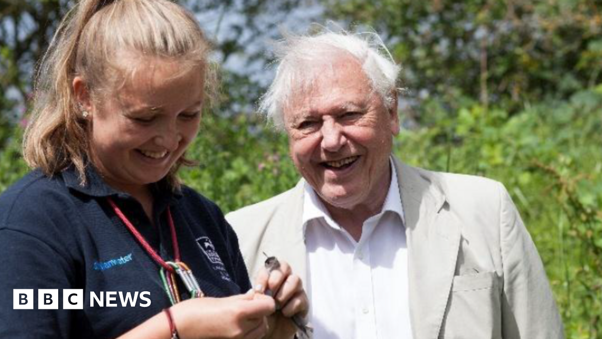 Sir David Attenborough with a member of Leicestershire and Rutland Wildlife Trust at a bird ringing demonstration at the Volunteer Training Centre in Rutland
