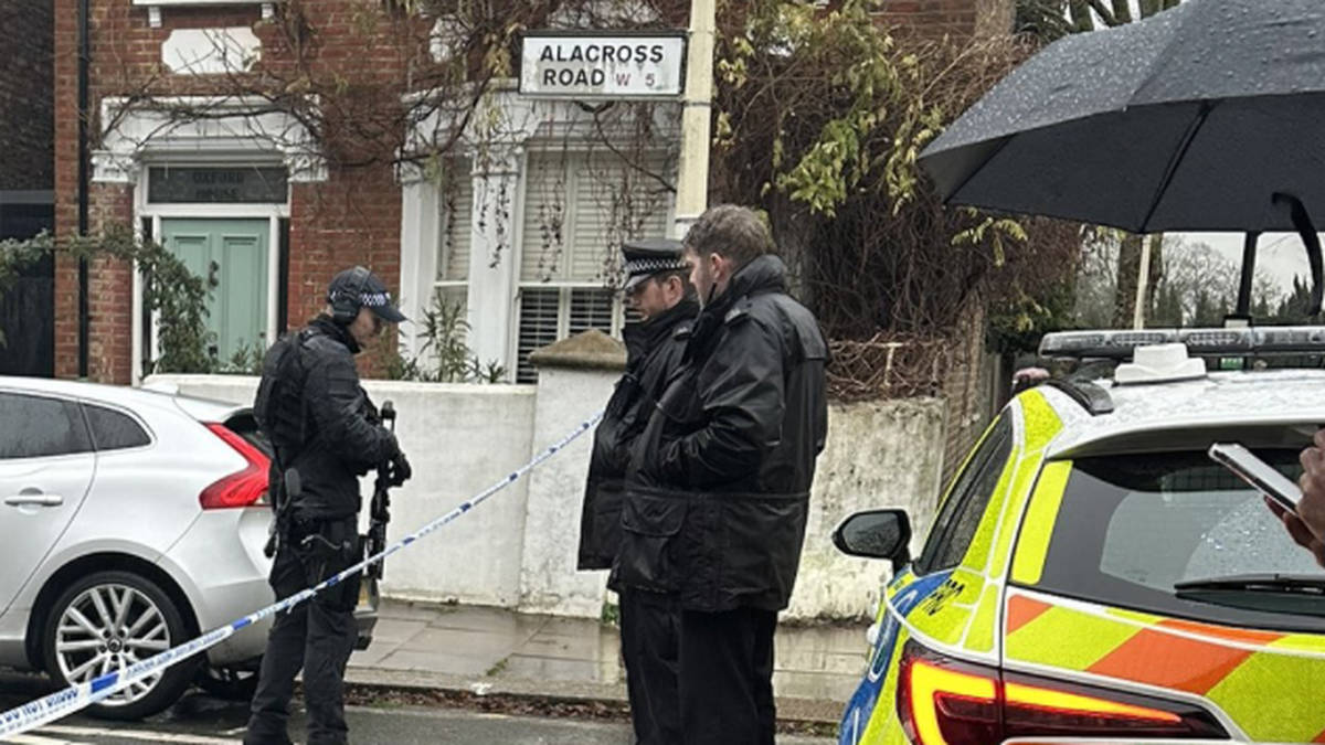 Armed police rush to leafy west London street following reports of man 'in possession of knives'