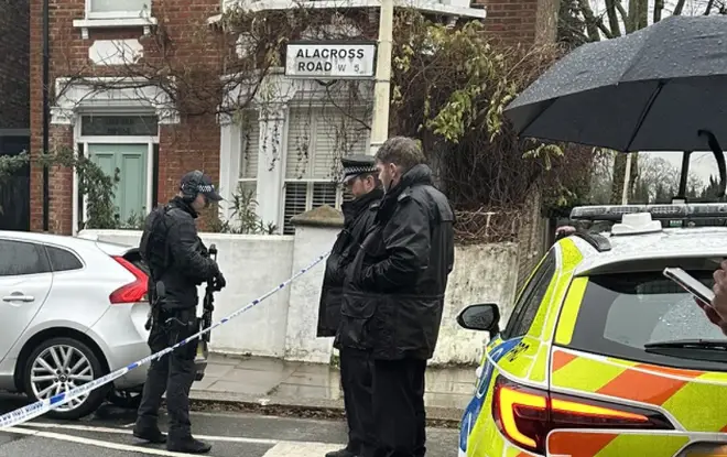 Armed police gather on Venetia road in South Ealing.