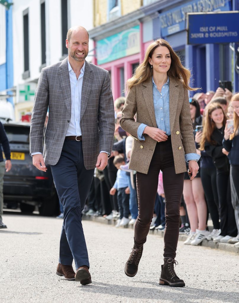 Prince William, Prince of Wales, known as the Duke of Rothesay and Catherine, Princess of Wales, known as the Duchess of Rothesay when in Scotland, smile to well-wishers as they arrive for a visit to Aros Hall, a local community hub on April 29, 2025 in Tobermory, Scotland. The Prince and Princess of Wales are on a two-day visit to the Isles of Mull and Iona on the 29th and 30th of April to engage with rural island communities. During their time on the islands, they will connect with local residents, highlighting the value of social bonds and underscoring the importance of safeguarding and advocating for the natural environment. (Photo by Chris Jackson/Getty Images)