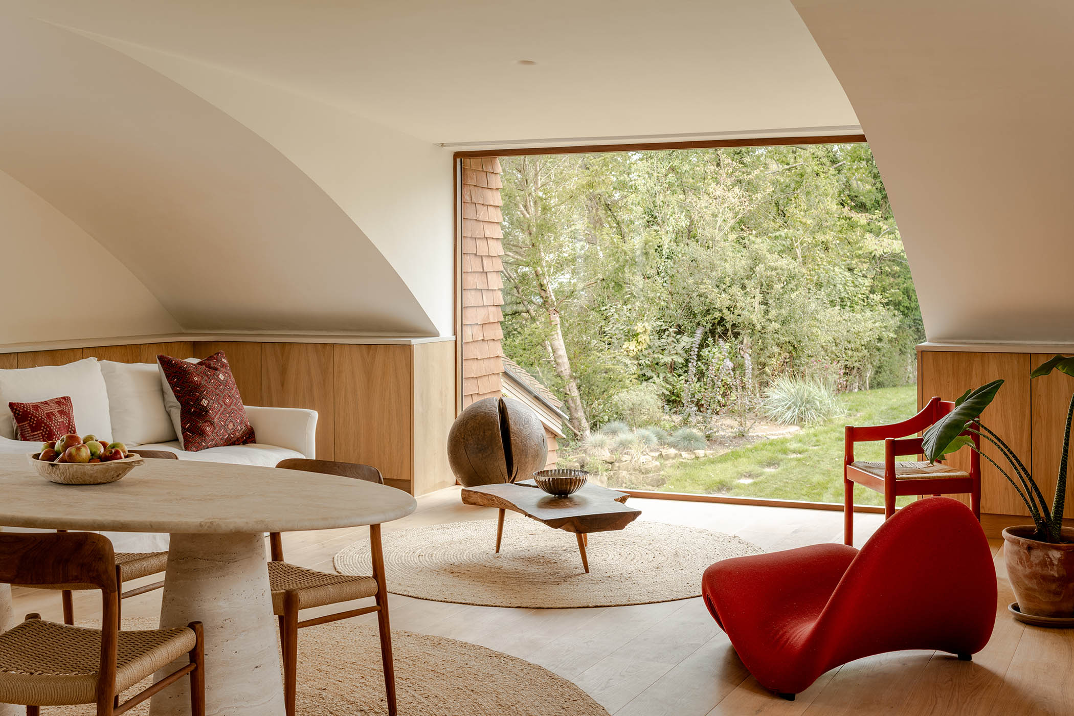 Pale oak floors and lime-plastered walls in the open-plan living-room