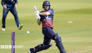 Jake Lehmann plays shot through the covers wearing Lancashire white ball clothing