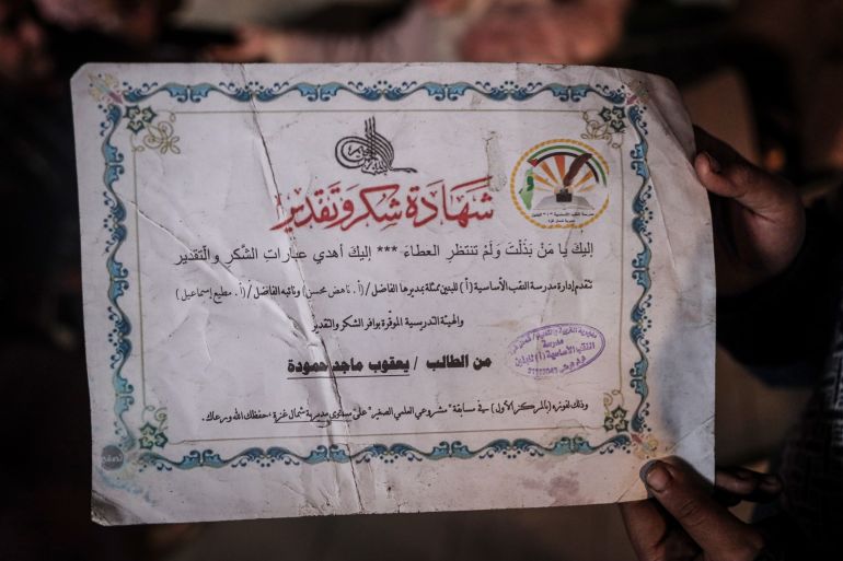 Hamoud’s son’s certificate that shows his school’s appreciation, as he won the competition for “My Little Scientific Project” over the Directorate of Education, North Gaza