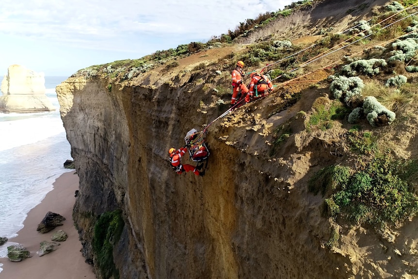 SES Volunteers performing rescue training on a tall cliffside near ocean