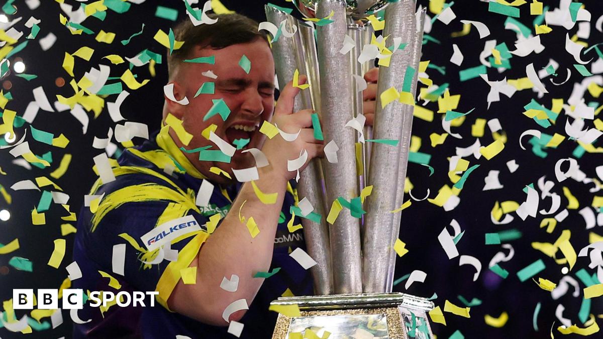Luke Littler celebrates winning the 2026 PDC World Championship as tickertape falls