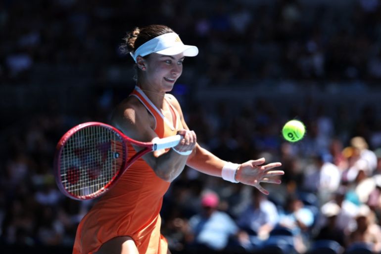 USA's Iva Jovic hits a return to Kazakhstan's Yulia Putintseva during their women's singles match on day eight of the Australian Open tennis tournament in Melbourne on January 25, 2026. (Photo by Martin KEEP / AFP) / -- IMAGE RESTRICTED TO EDITORIAL USE - STRICTLY NO COMMERCIAL USE --