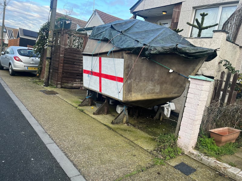 An England flag painted on part of a boat outside a property in Jaywick. Photograph: Mark Paul