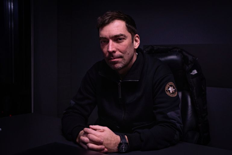 Igor Novikov, former advisor to Volodymyr Zelenskyy sits in his Kyiv office [Nils Adler/Al Jazeera]