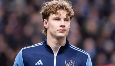 August Priske lines up in a tracksuit top before a match