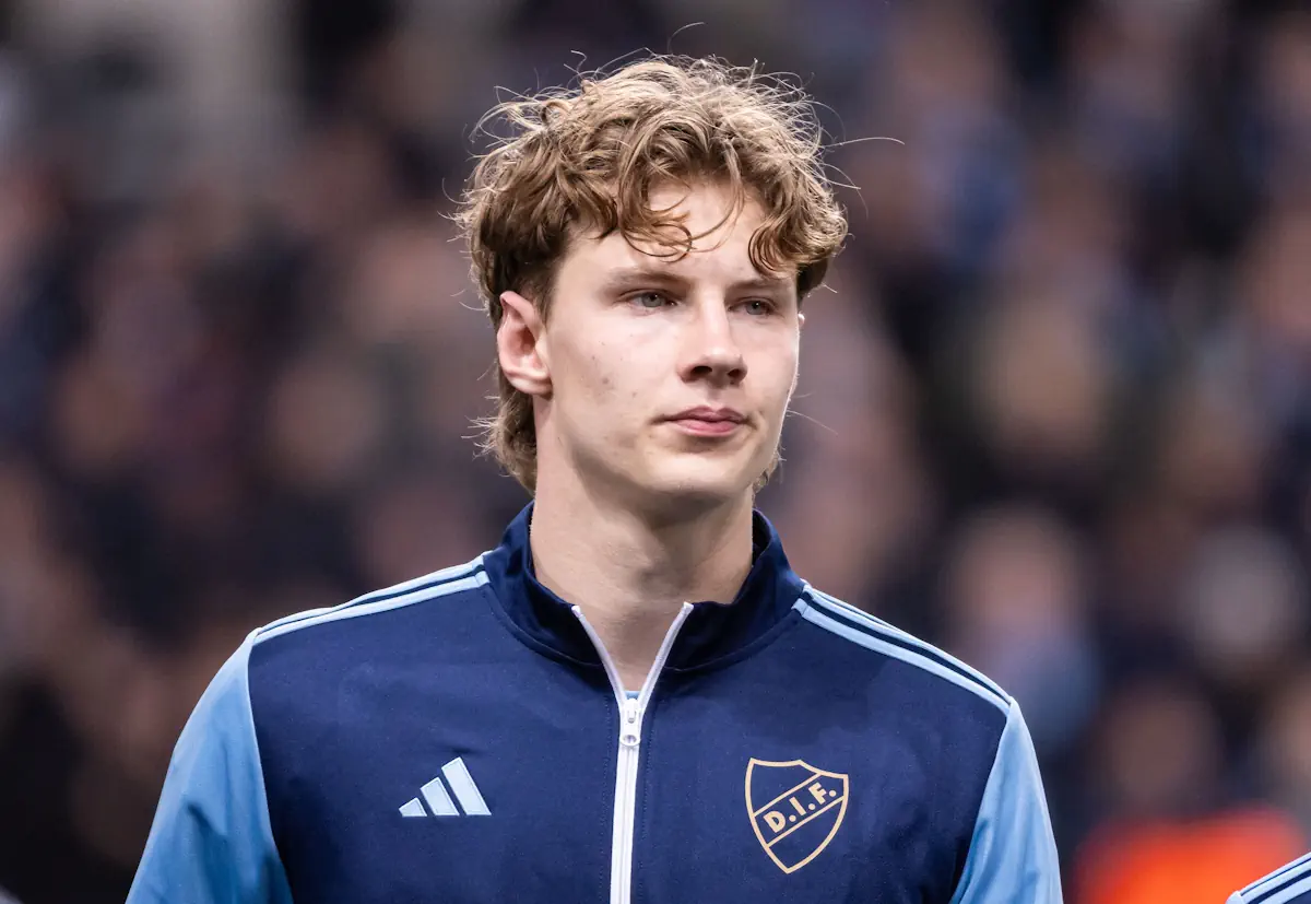 August Priske lines up in a tracksuit top before a match