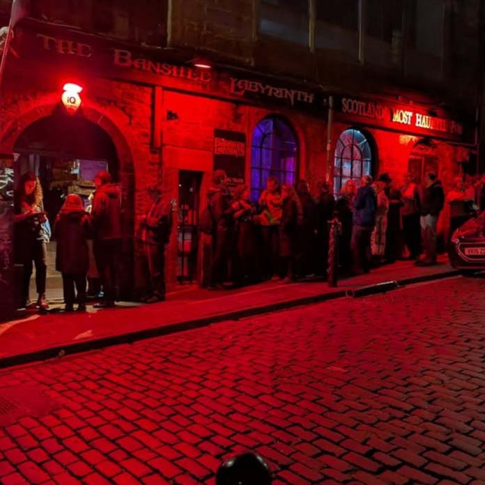 Patrons queue outside Banshees Labyrinth for the Edinburgh Horror Festival (C) Edinburgh Horror Festival / Instagram