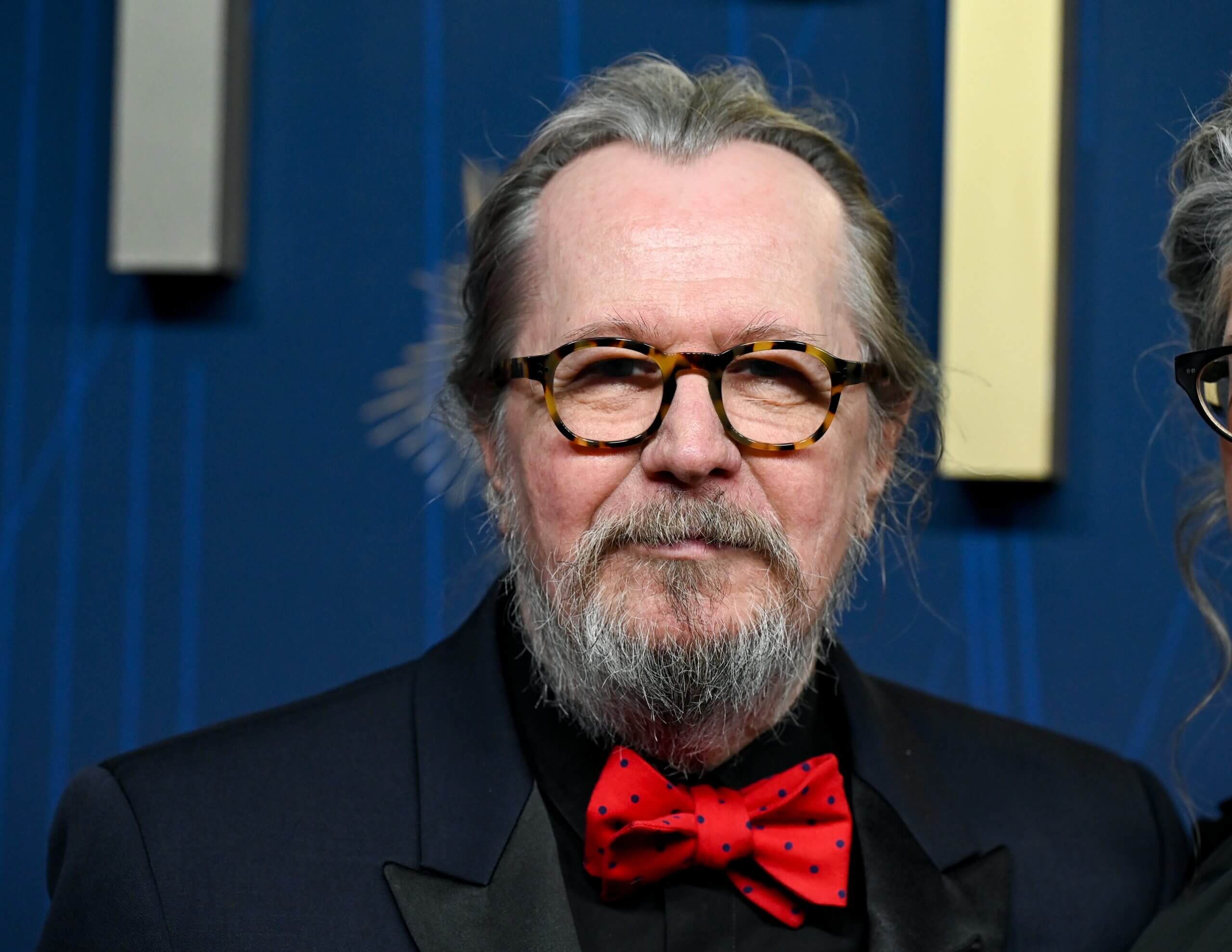 Actor Gary Oldman wearing a red bow tie