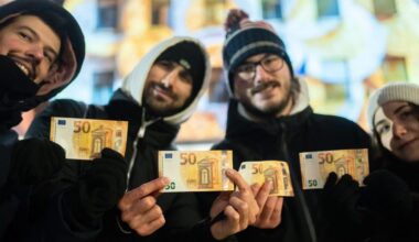 Cash machines in former communist country issue euros for first time after joining currency union