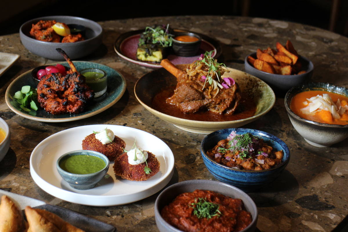 an array of curry dishes presented on a table