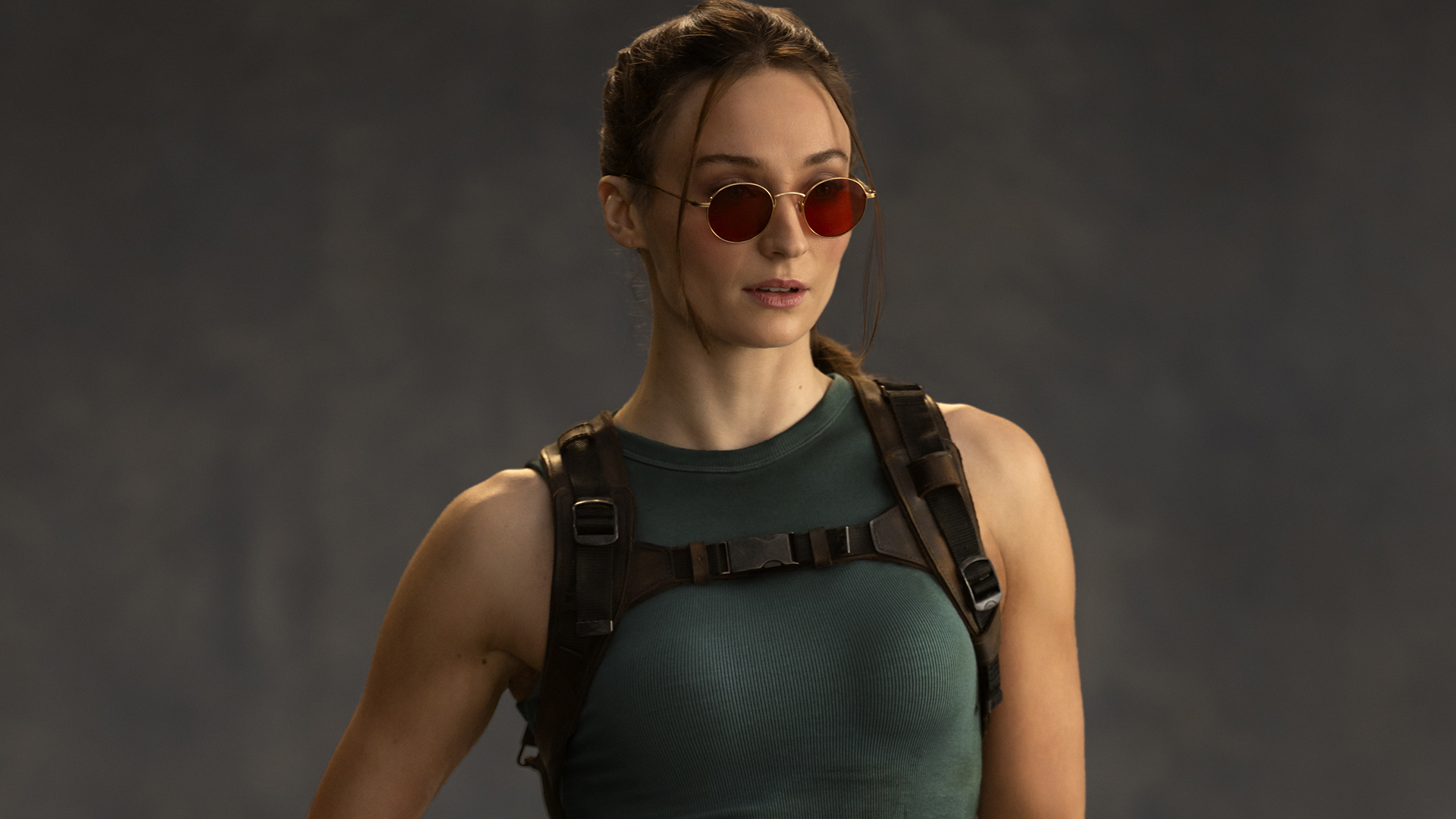 A professional image of Sophie Turner wearing Lara Croft's classic costume in Prime Video's Tomb Raider TV show