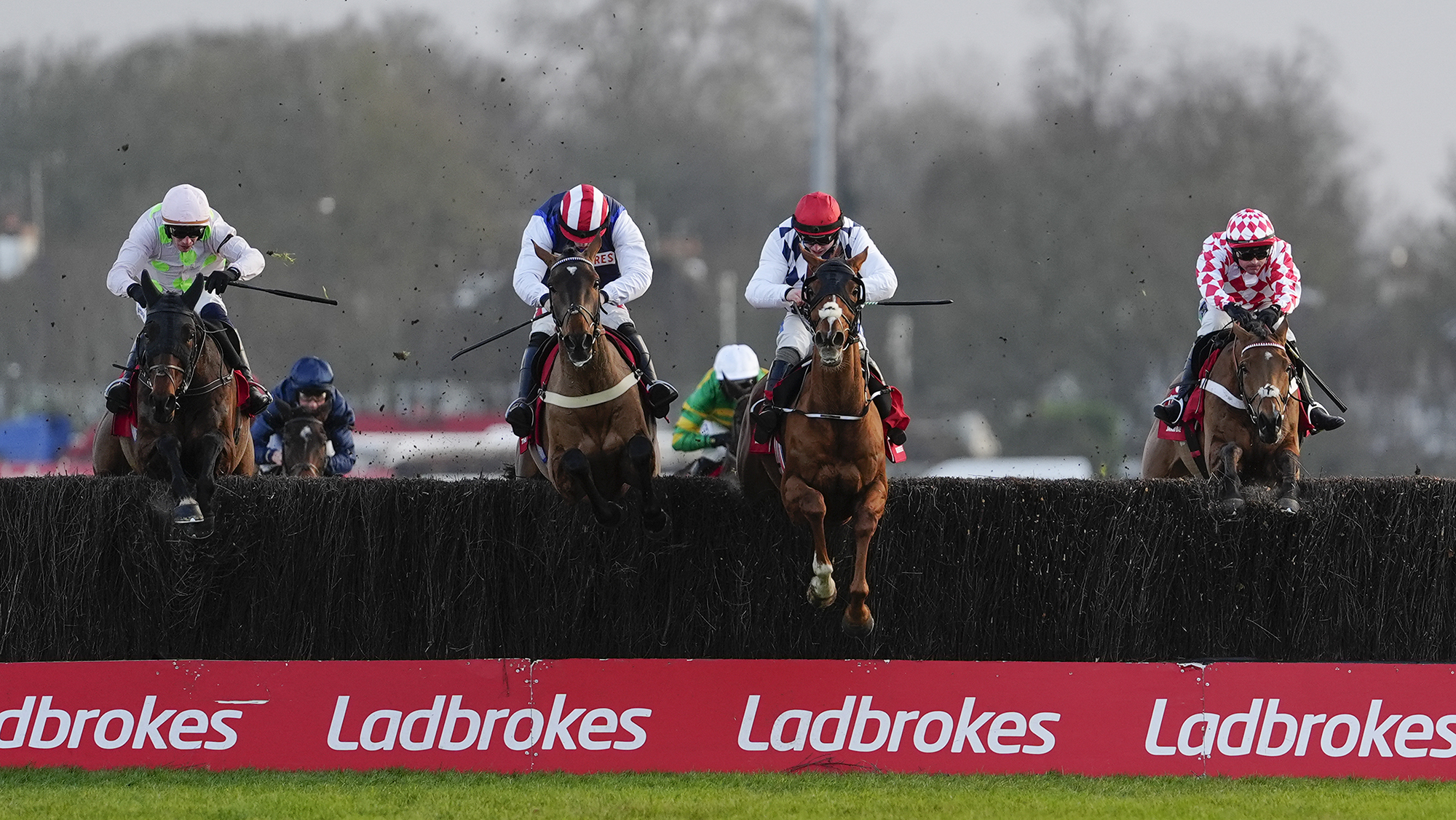 The Jukebox Man is one of four horses clearing the last at Kempton in a line as they race to win the Ladbrokes King George VI Chase 2025.