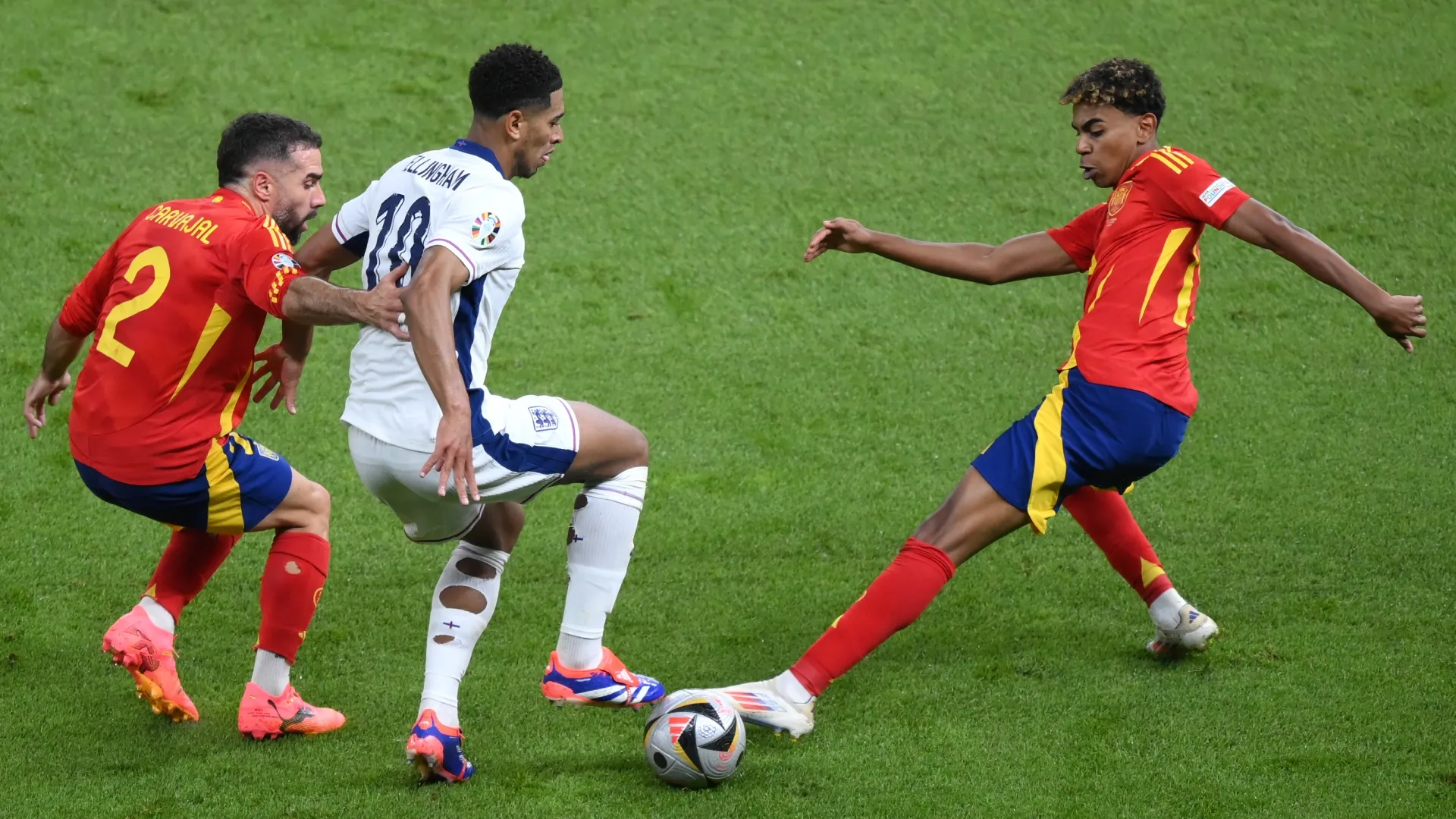 England's Jude Bellingham and Spain's Dani Carvajal and Lamine Yamal
