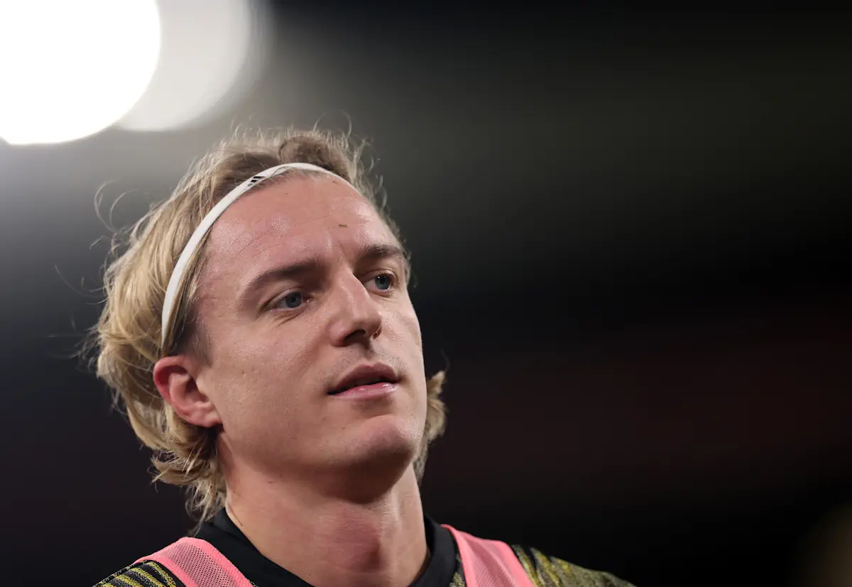Leeds United defender Sebastiaan Bornauw warms up under the floodlights