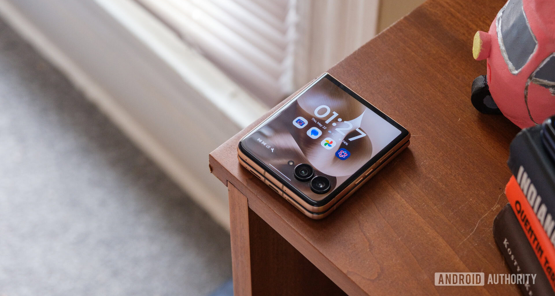 Motorola Razr Ultra on bookshelf