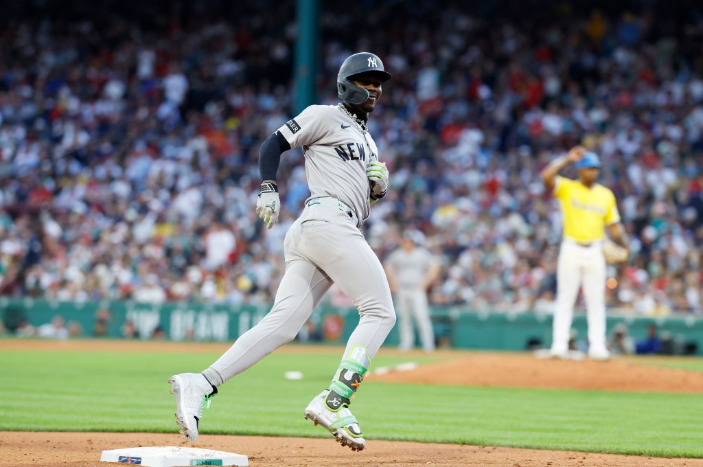  Jazz Chisholm Jr. #13 of the New York Yankees reacts as he rounds the bases on his solo homer during the fifth inning.