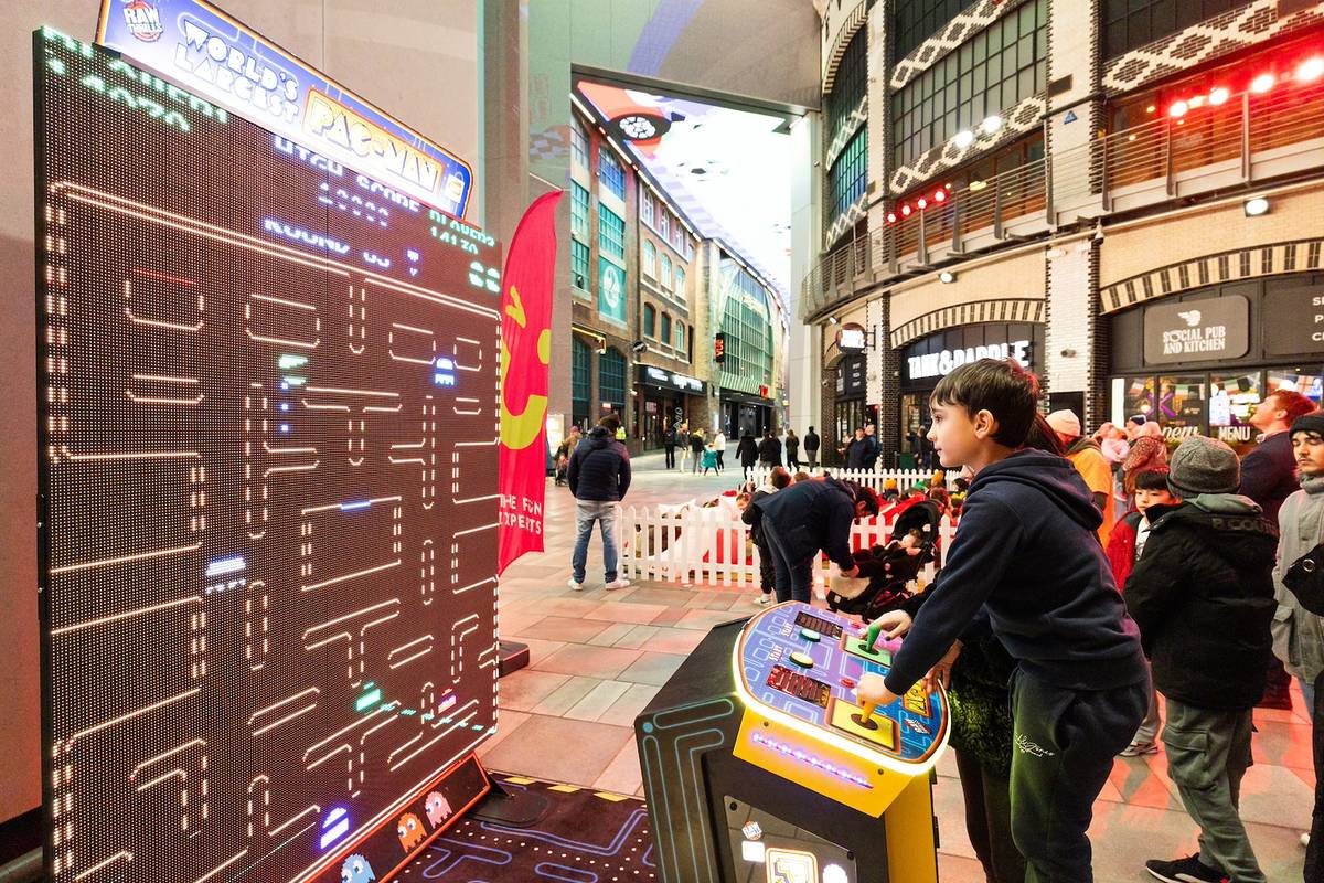 child playing video games in printworks