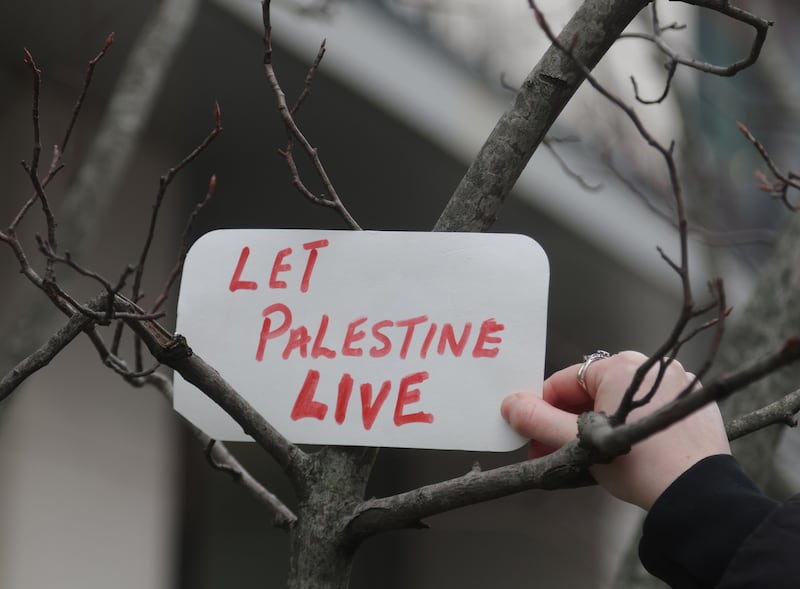 Ireland Palestine Solidarity Campaign during a vigil from Writers square to Erskine on New Years Eve.
PICTURE COLM LENAGHAN