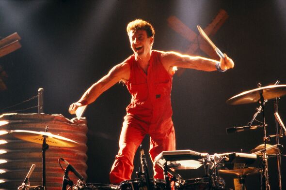 Rob Hirst performing with Midnight Oil 