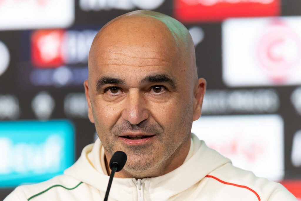 Roberto Martinez sits in a press conference.