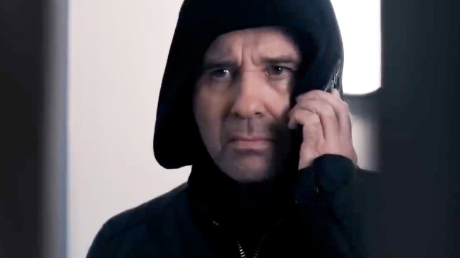 Emmerdale's Graham Foster stands in a hospital while on the phone in Corriedale