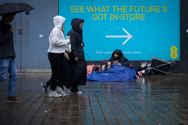 MANCHESTER, UNITED KINGDOM - SEPTEMBER 01: A man begs for small change on September 01, 2025 in Manchester, United Kingdom. (Photo by Christopher Furlong/Getty Images)