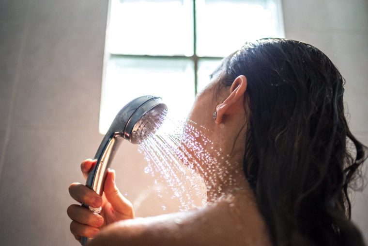 Unrecognizable woman showering