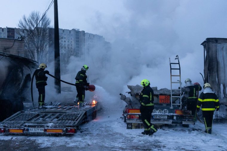 Ukrainian emmergency personnel work to extinguish a fire at the site of an air attack in Kyiv on January 24, 2026, amid the Russian invasion of Ukraine. Russian strikes killed one person and injured 23 others in Ukraine's capital and the northeastern city of Kharkiv overnight, authorities said early on January 24, 2026. The country was under an air raid alert with military authorities in Kyiv warning of drones and ballistic missiles. (Photo by Oleksandr Magula / AFP via Getty Images)