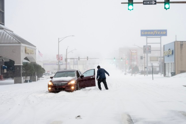 Lonesome car and driver stranded in the snow