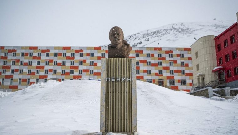 A monument to Lenin is pictured during blizzard on May 7, 2022, in the miners' town of Barentsburg, on the Svalbard Archipelago, northern Norway. War may be far away but tensions from the Ukraine conflict are causing an unprecedented chill in a remote Arctic town where Russian and Ukrainian coalminers have worked side by side for decades. (Photo by Jonathan NACKSTRAND / AFP) (Photo by JONATHAN NACKSTRAND/AFP via Getty Images)