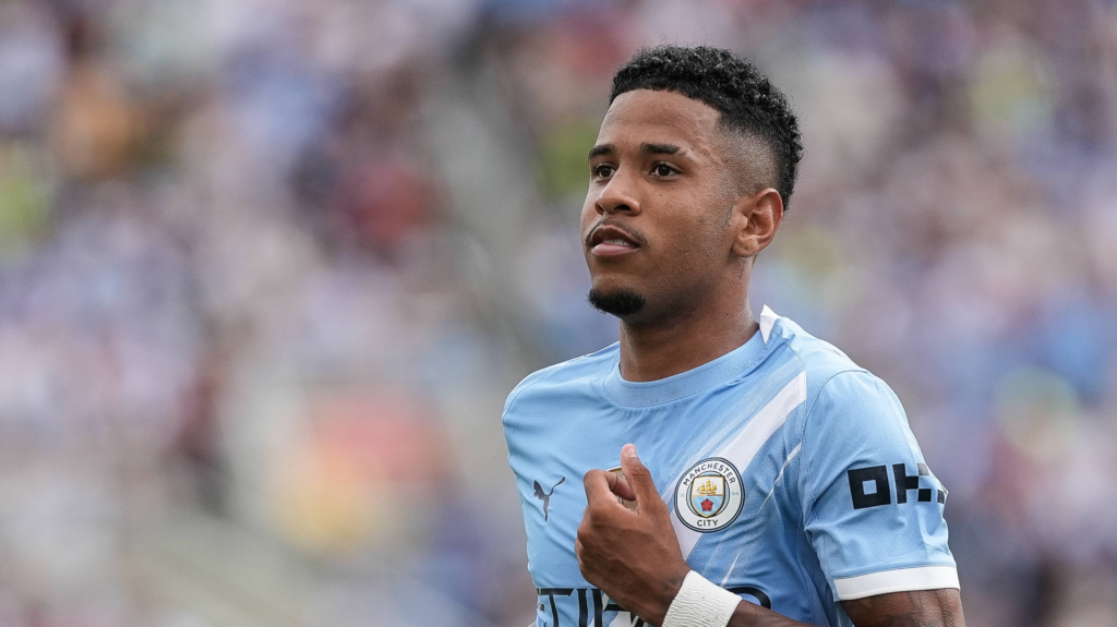 Savinho in a Man City shirt running during a match